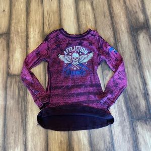 Affliction Reversible with different designs. Basically a 2 in 1 shirt